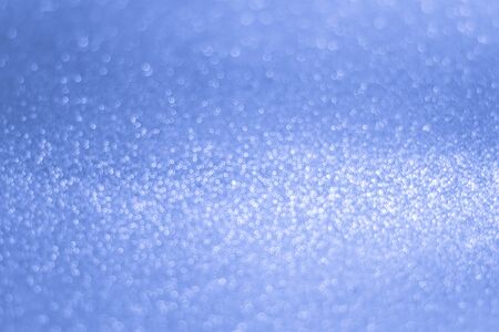 Glittery shiny lights blue abstract bokeh backgroundの写真素材