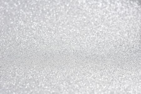 Glittery shiny lights silver abstract bokeh backgroundの写真素材