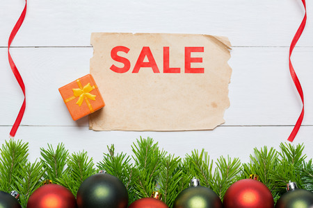 Christmas fir tree and aged paper sheet. Sale conceptの写真素材