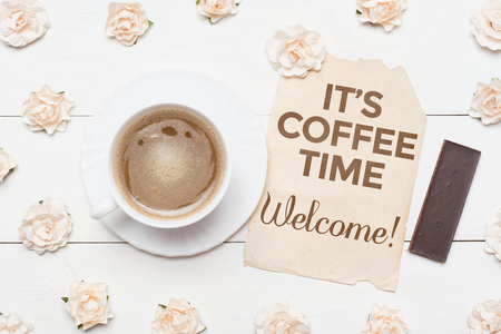 Cup of coffee and paper sheet. It's coffee time. Welcome!の写真素材