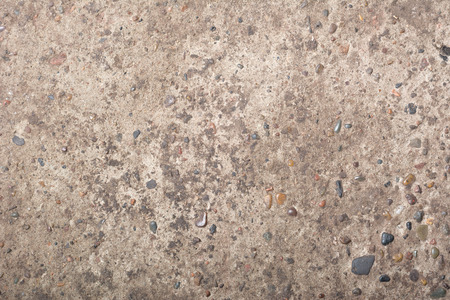 Rough cement texture with rocks backgroundの写真素材