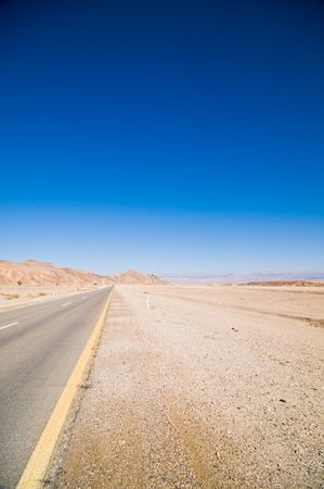 Desert road stretching into distance