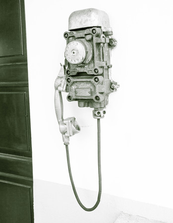 Old vintage pay phone with rotary dialの写真素材