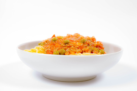 Gluten-free spaghetti bolognese with pea (corn and rice pasta)の写真素材
