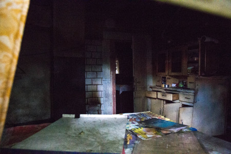 The inside of an abandoned house seen through a windowの写真素材