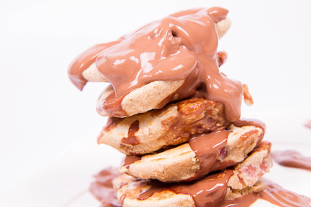 Pancakes with apples covered with chocolateの写真素材