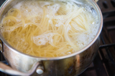 Pasta being cookedの写真素材