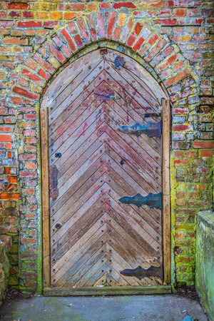 Old door in an antique wallの写真素材