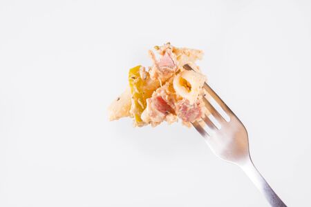 Pasta - penne with cream sauce and jalape?o peppers on a forkの写真素材