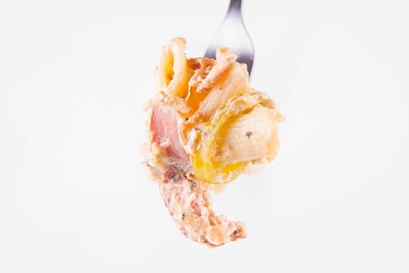 Pasta - penne with cream sauce and jalape?o peppers on a forkの写真素材