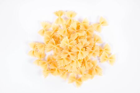 Raw Farfalle pasta on a white backgroundの写真素材