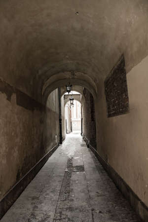 An alley - historic architecture of the old town of Warsaw, Polandの写真素材
