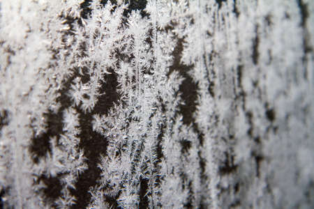 Frost patterns on glass in a close up