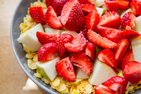 Cornflakes with fruit - apple, pear and strawberries