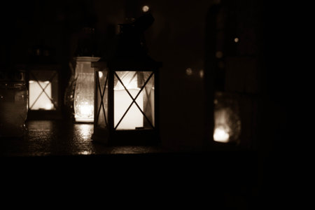 Votive candle burning at a cemetery at nightの写真素材
