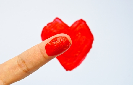 Painting heart shape be acrylic color and finger の写真素材