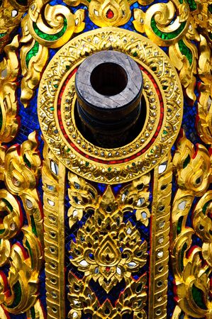 Thai art, old cannon on golden ship の写真素材