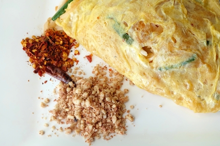 Pad Thai wrapped with fried eggの写真素材