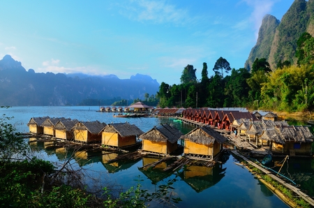 Huts and the relection at Ratchaprapa dam, Thailandの写真素材
