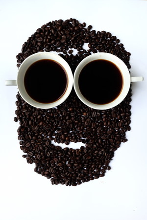 Two cups of black coffee with man faceの写真素材