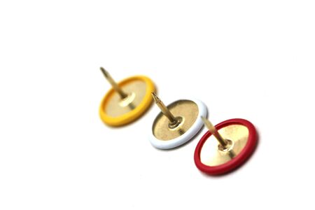 red,yellow and white thumbtackの写真素材