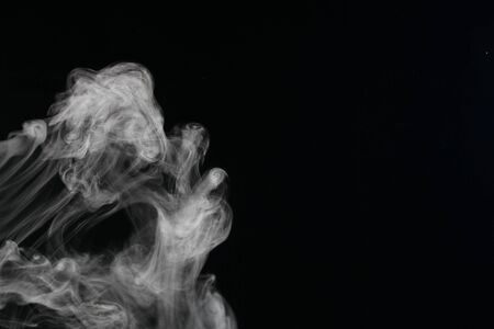 an abstract smoke picture in front of a black backgroundの写真素材