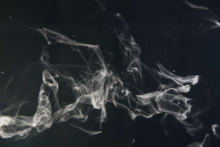 an abstract smoke picture in front of a black backgroundの写真素材