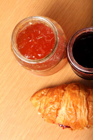 morning croissant with fruit jamsの写真素材