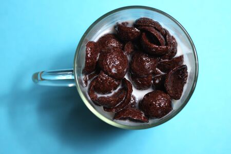 chocolate flakes with milk in glassの写真素材