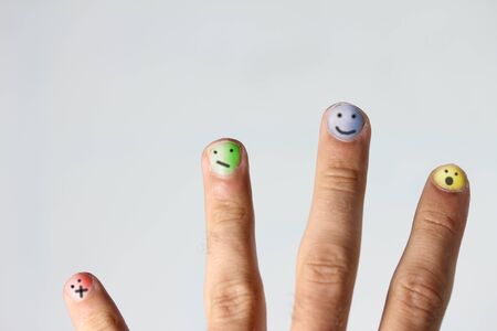smiley faces on colored fingernails
