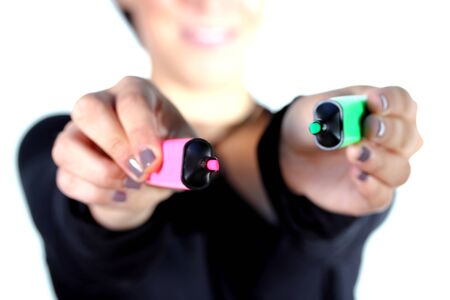 girl with red and green marker pensの写真素材