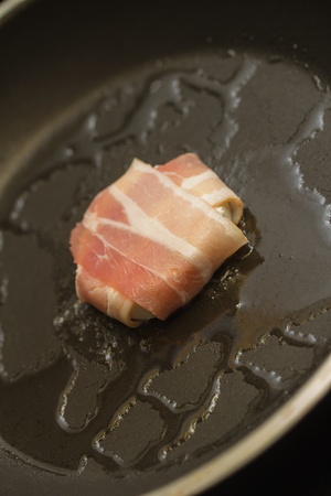 delicous grilled bacon around sheep cheeseの写真素材