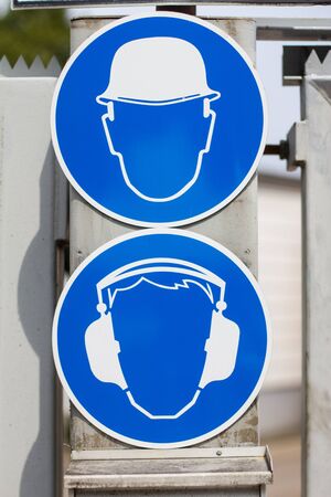 hearing protection and helmet  mandatory signsの写真素材