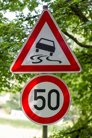 slippery roadway signの写真素材