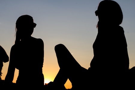 woman silhouettes in dawnの写真素材