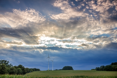 big electricity wind wheels in a countryside eveningの写真素材