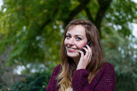 beautiful young woman with a smartphone