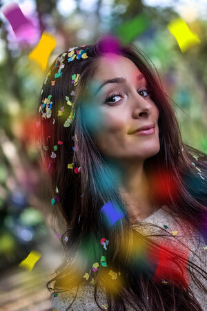 young party woman with confetti flying around