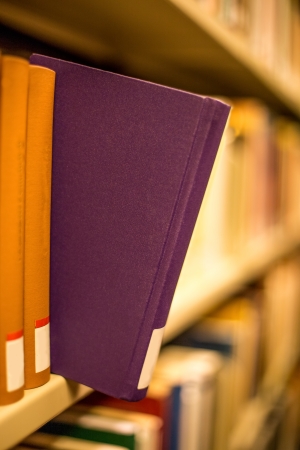 plain book jut out a bookshelfの写真素材