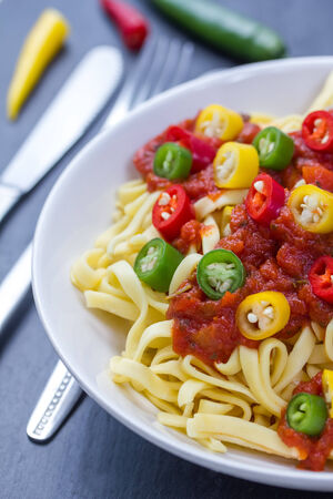 bowl of pasta with spicy tomatoe sauceの写真素材