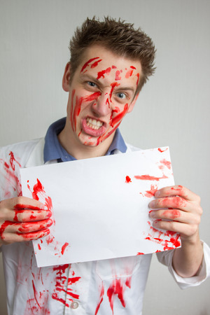 crazy funny guy covered in bloodの写真素材