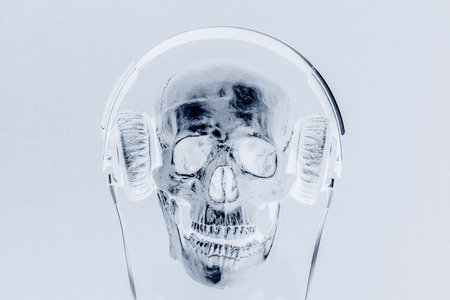 human skull with headphones x-ray backgroundの写真素材