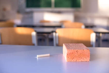 class room background with a chalk piece in frontの写真素材