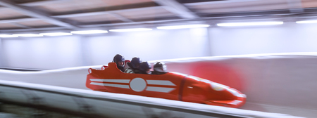 bob sled speeding in an ice channelの写真素材