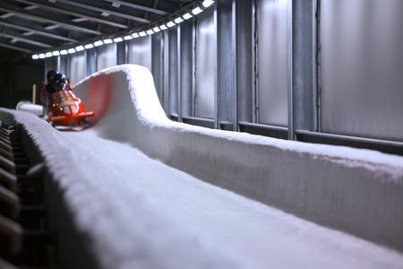 bob sled speeding in an ice channelの写真素材