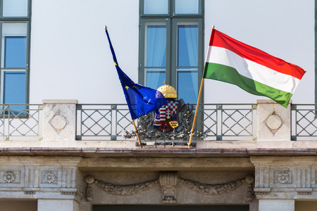 the hungarian national flag on the hungarian parliament building