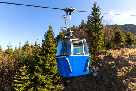 small funicular in front of mountain hillsの写真素材