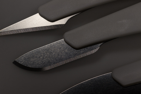 medical scalpels shadow background