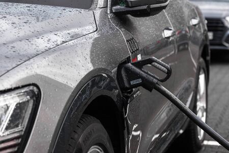 siegen, North Rhine-Westphalia/germany - 14 12 19: audi e-tron car loading on a rainy day near...