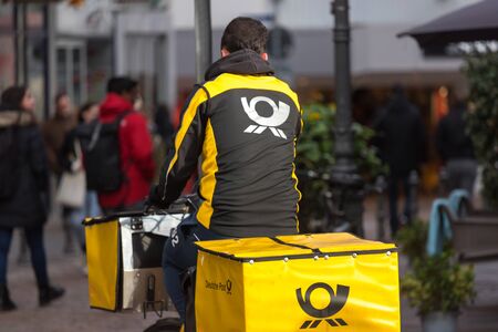 aachen, North Rhine-Westphalia/germany - 18 01 2020: german post bicyclist in aachen germany